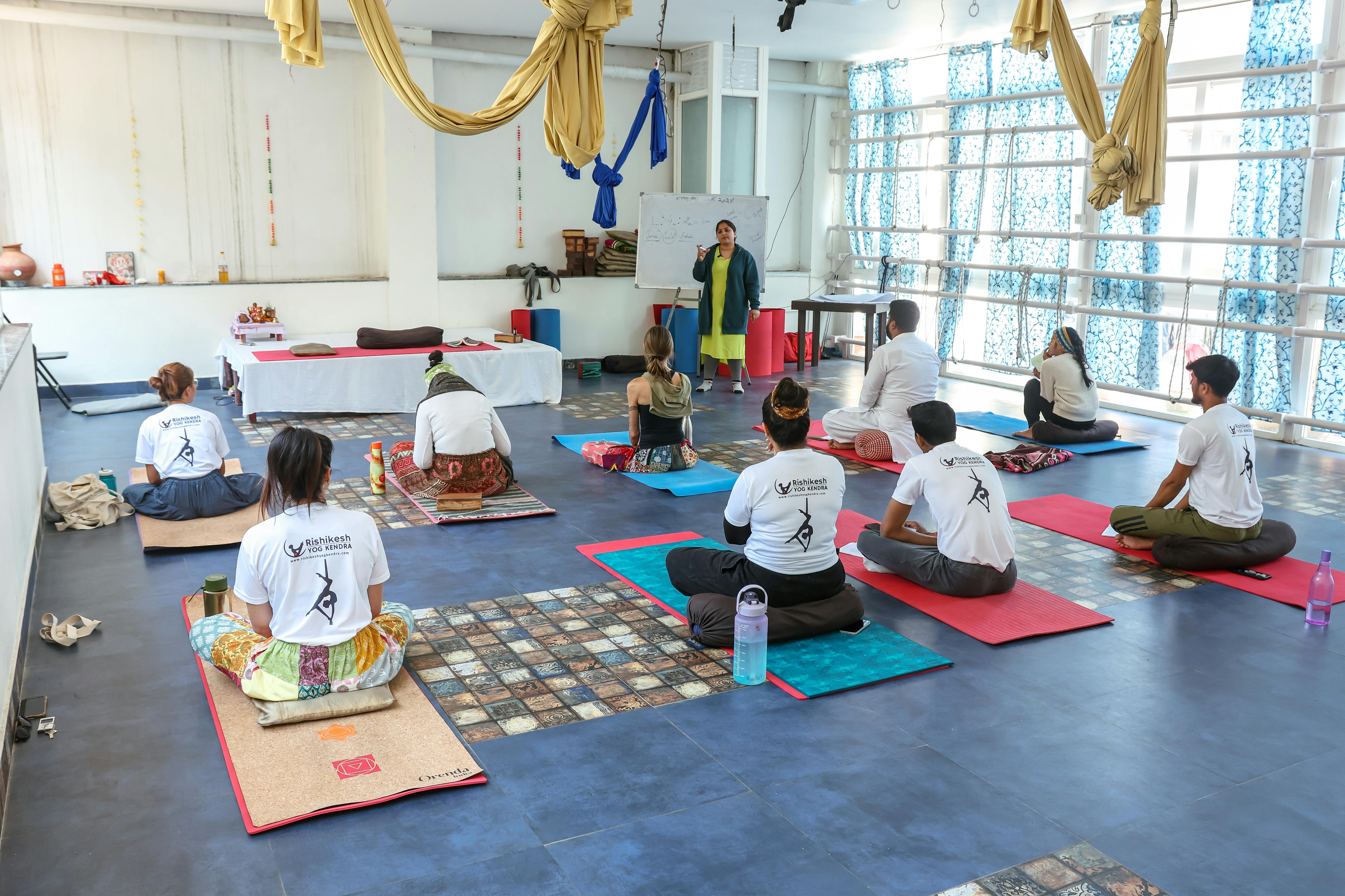 Yoga class in session inside a studio